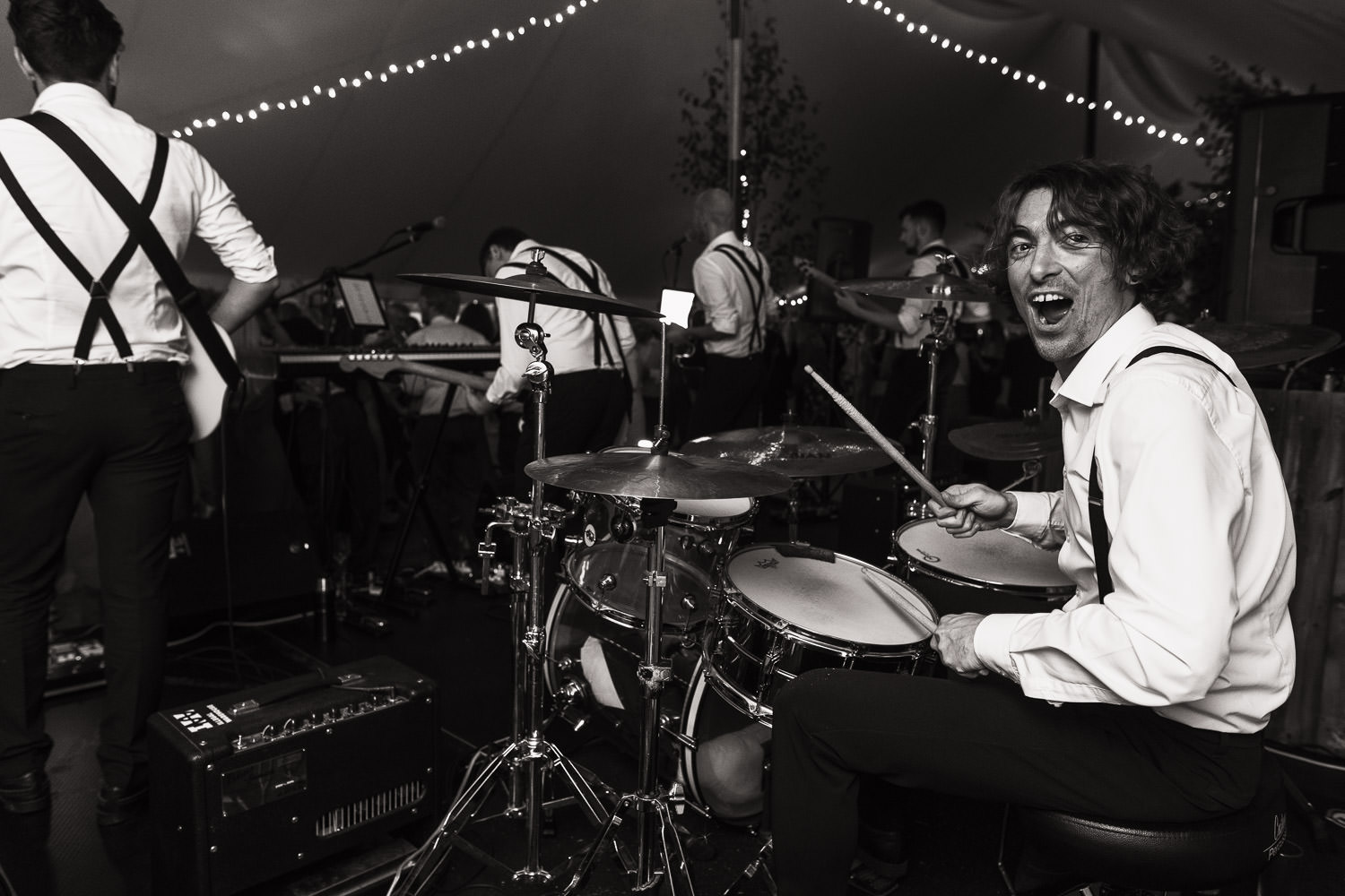 Will Daly on drums in Winston and the Lads looking at the camera at a wedding near South Woodham Ferrers.