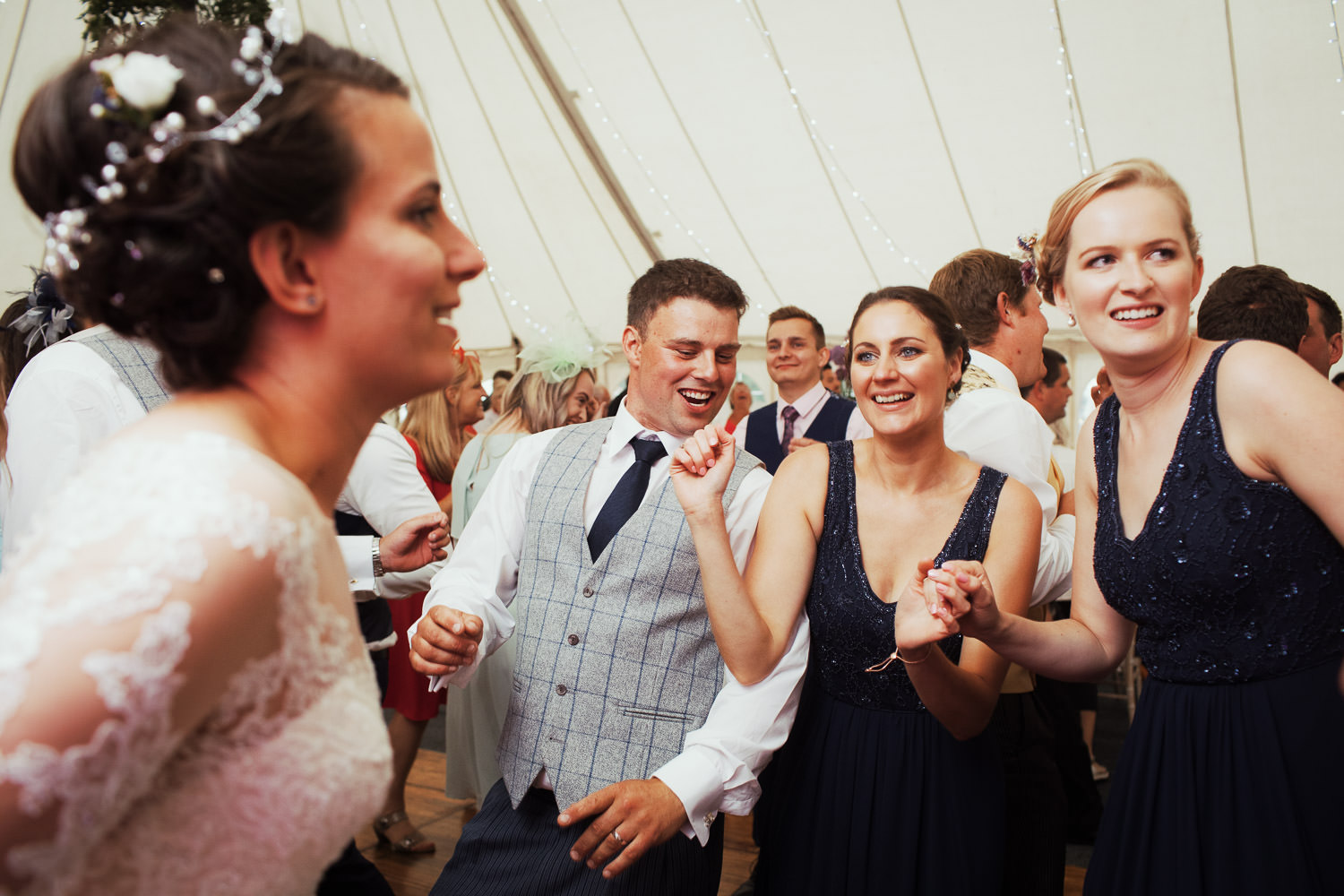 People dancing to a wedding band.