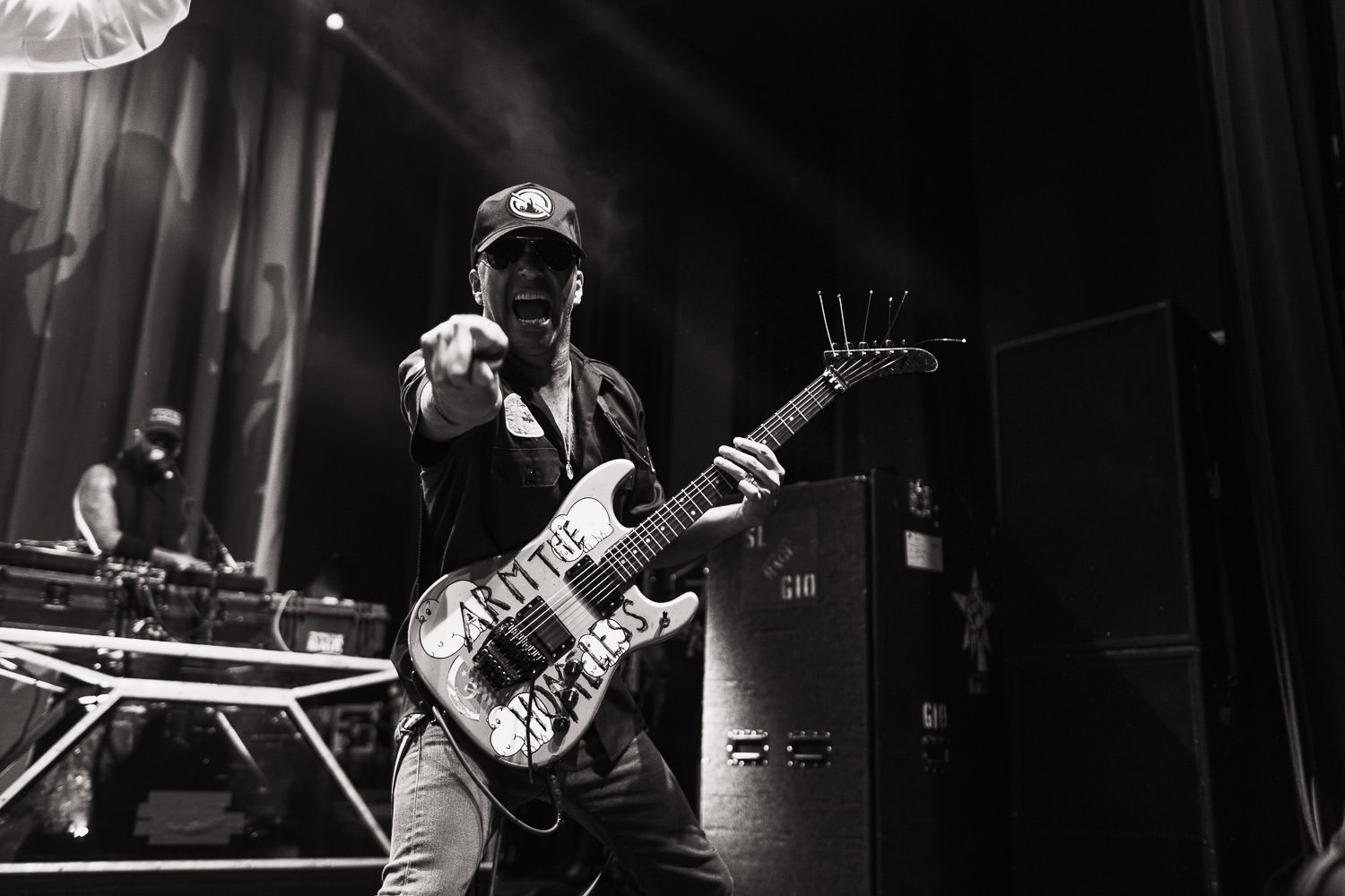 Tom Morello playing the Arm the Homeless guitar with Prophets of Rage, and pointing at the photographer Tracy.