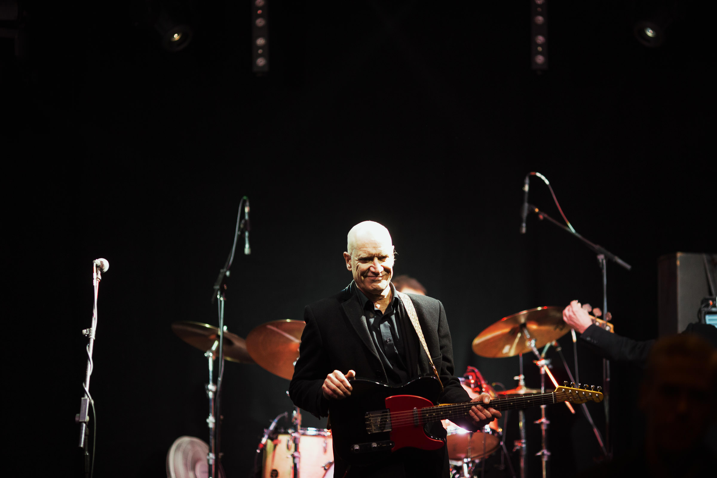 Wilko Johnson smiling during a soundcheck at the Cambridge Junction