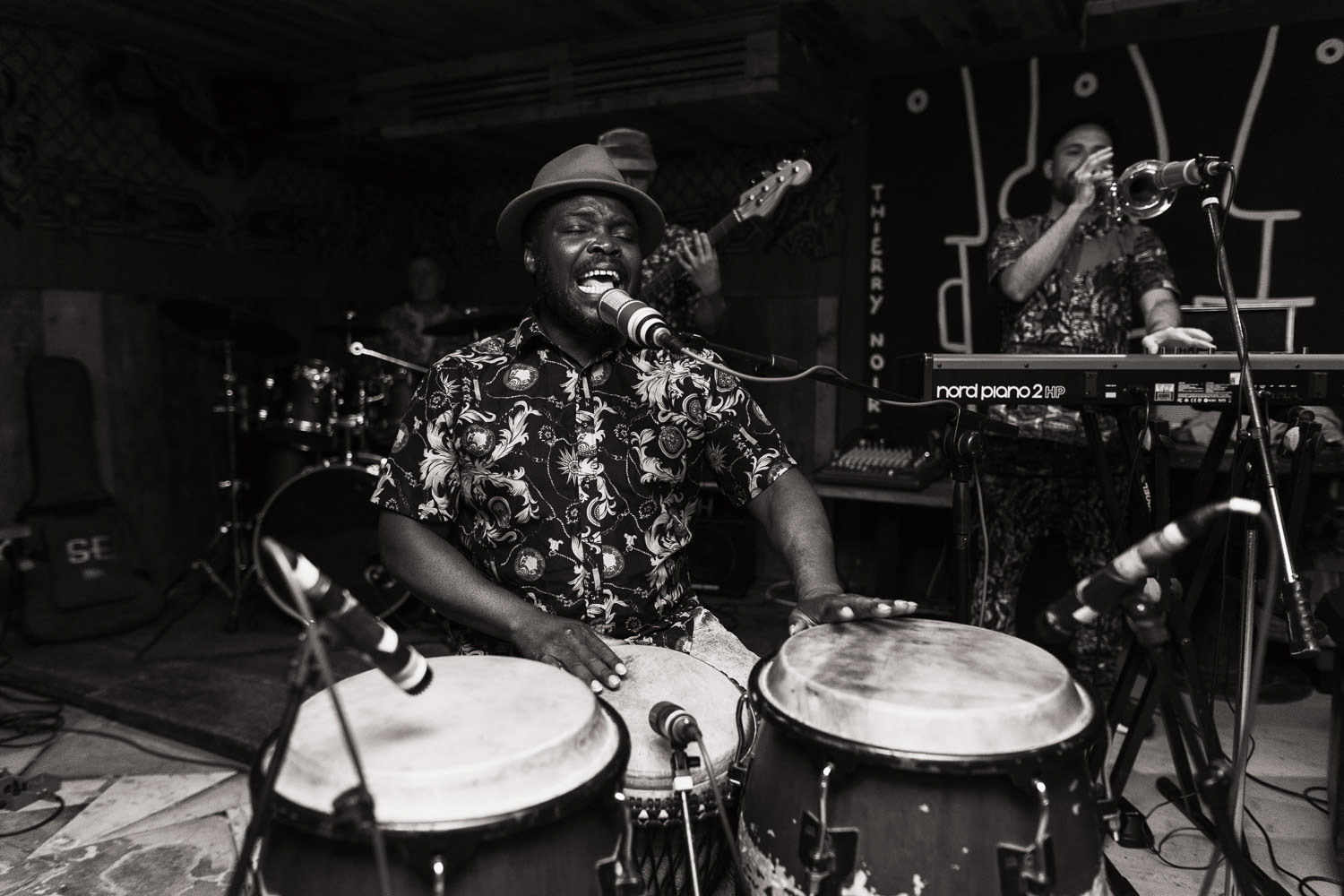 Afrik Bawantu playing at a wedding reception at Never For Ever in Kentish Town. djembe drummer,