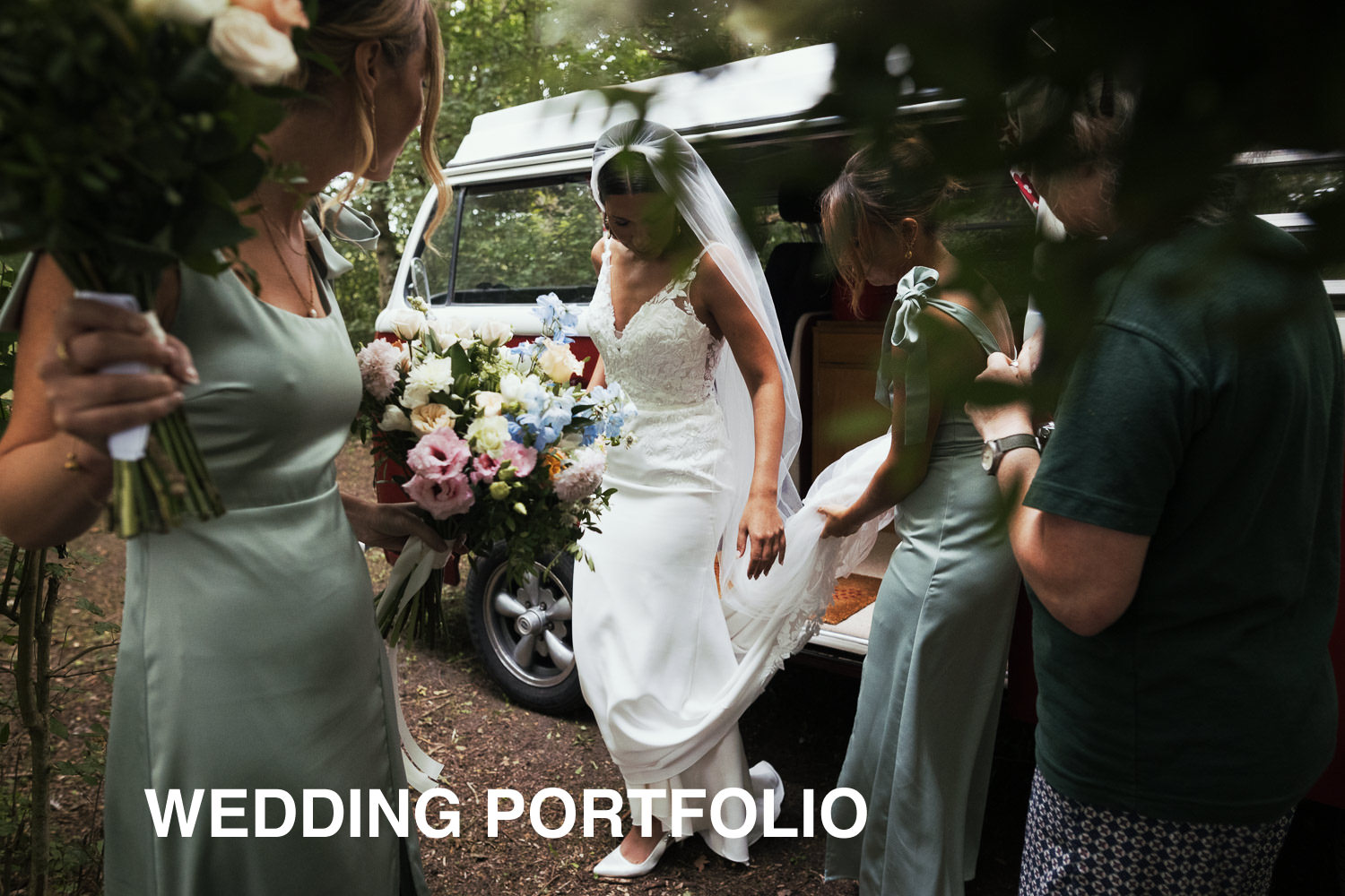 Documentary Wedding Photography Portfolio title section. Bride arrives at the woodland ceremony area in the campervan. Helped by bridesmaids wearing dresses from Oasis. Flowers by Tilly's Floral Designs. Maggie Sottero Baxley dress.