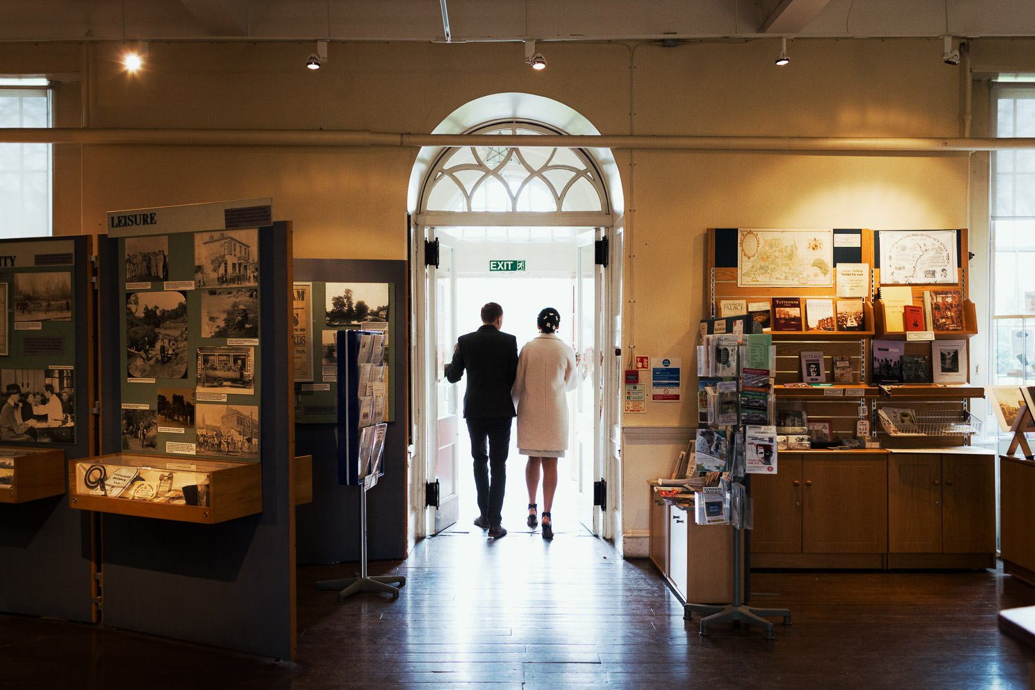 Newly married couple walk out of the Bruce Castle Museum front door, a 16th century manor house. Tottenham's only Grade I listed building.