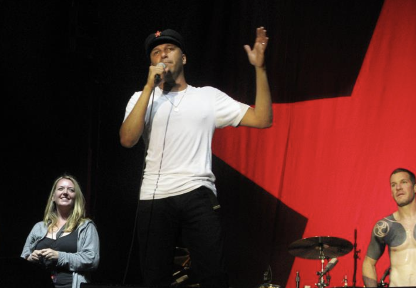 Photographer Tracy Morter on stage with tom Morello and Rage Against the Machine at Finsbury Park in 2010.