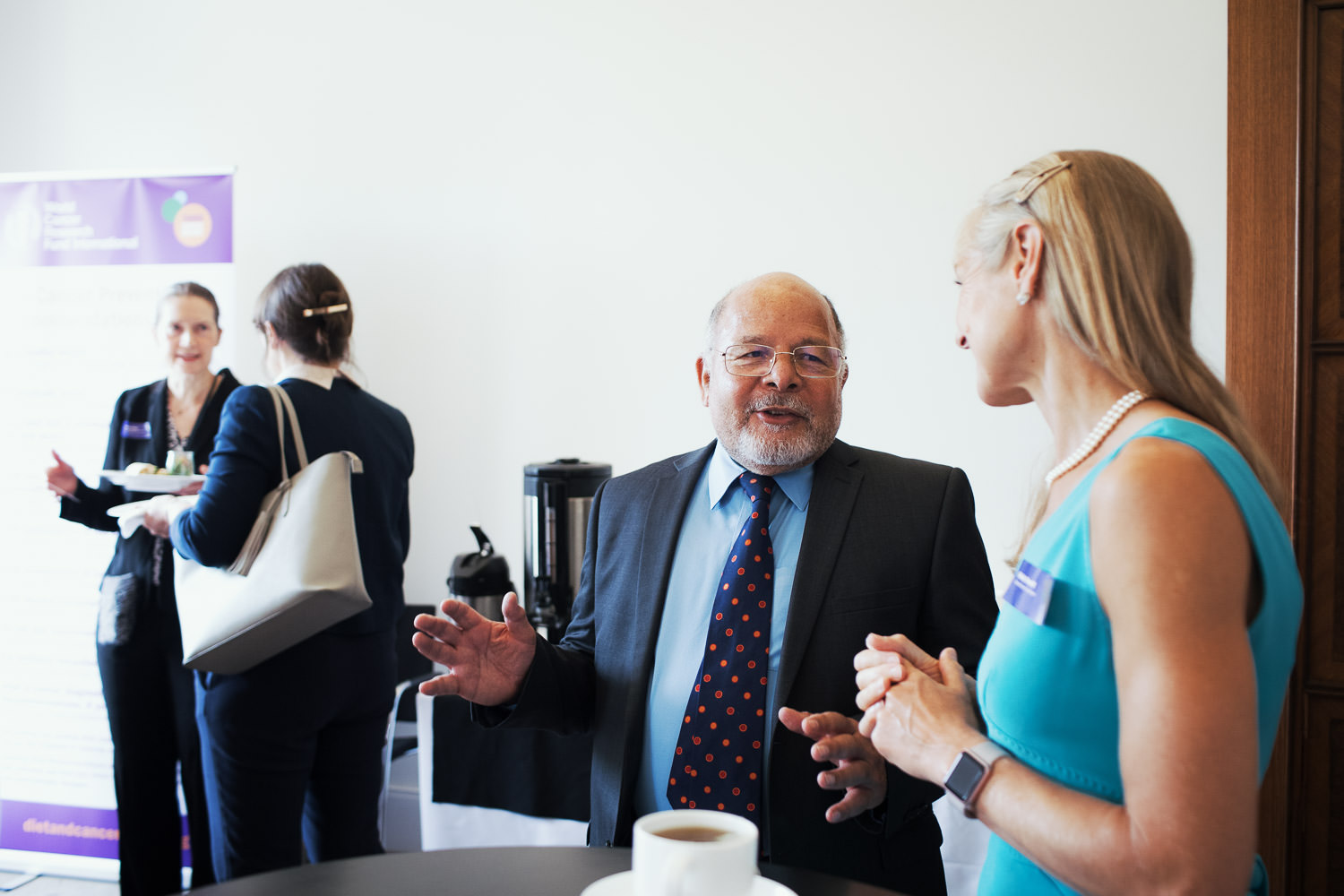 Health professionals chatting at a conference.