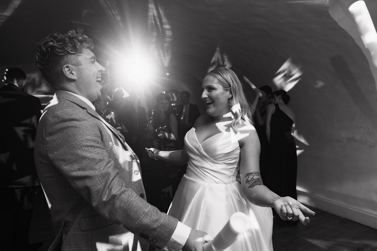 Bride with her Bridesman dancing at Leez Priory in the converted cellar dance floor. 
Essex Wedding in October.