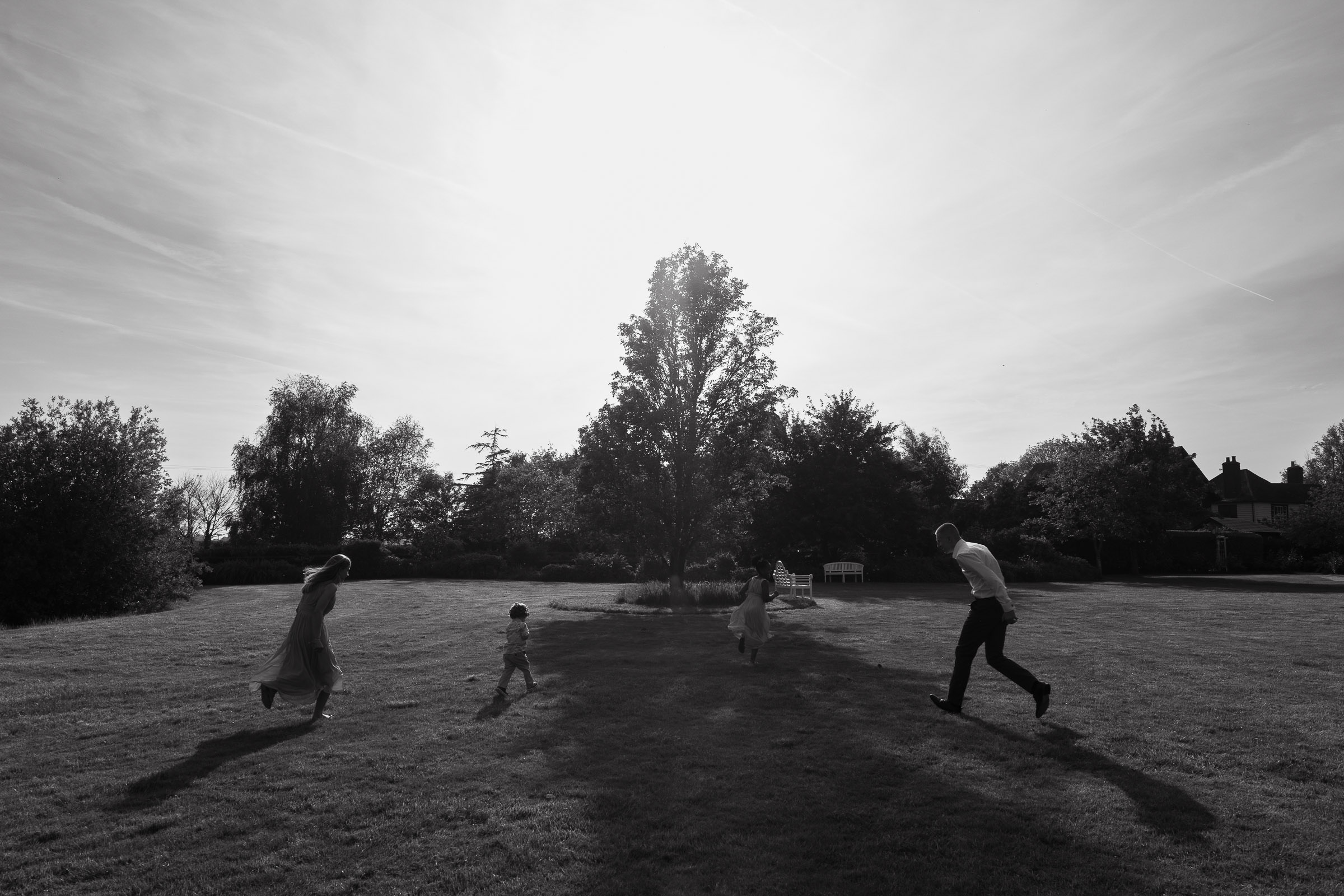 High House Wedding Venue, Essex: Flower girls and page boys playing on the lawn in the sunshine. CM3 6EW.