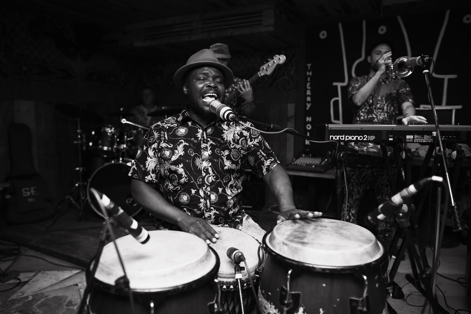 Afrik Bawantu playing at a wedding reception at Never For Ever in Kentish Town. djembe drummer,