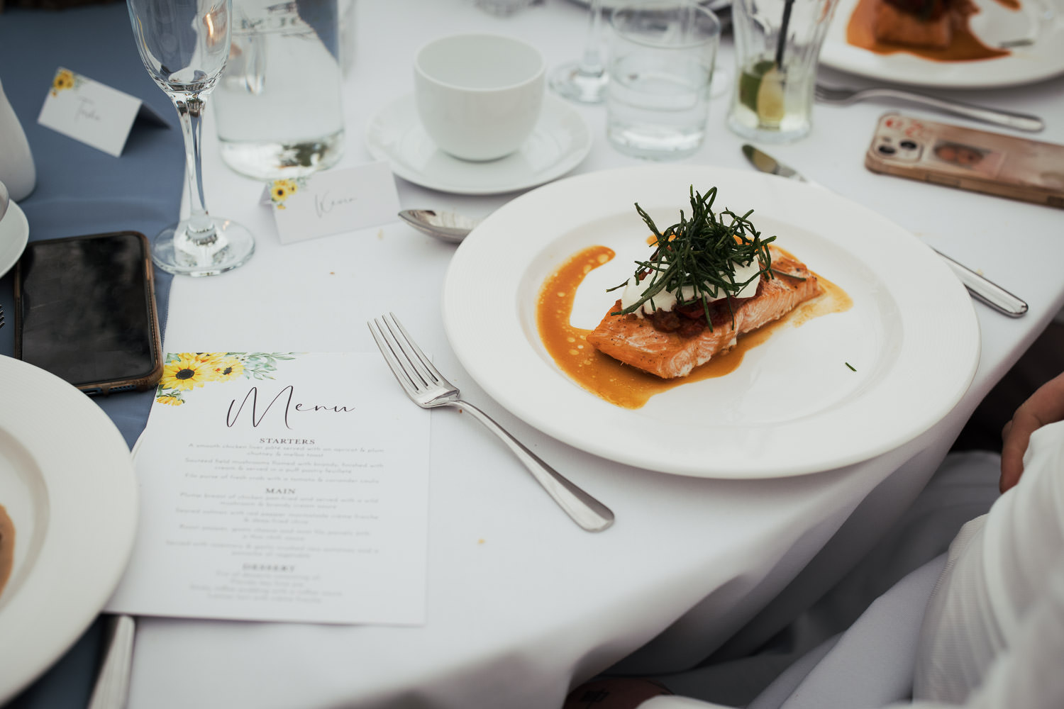 Valentine Cuisine caterers of South Woodham Ferrers at High House venue in nearby Althorne. A menu on the table next to a plate of seared salmon with red pepper marmalade crème fraiche & deep-fried chive.