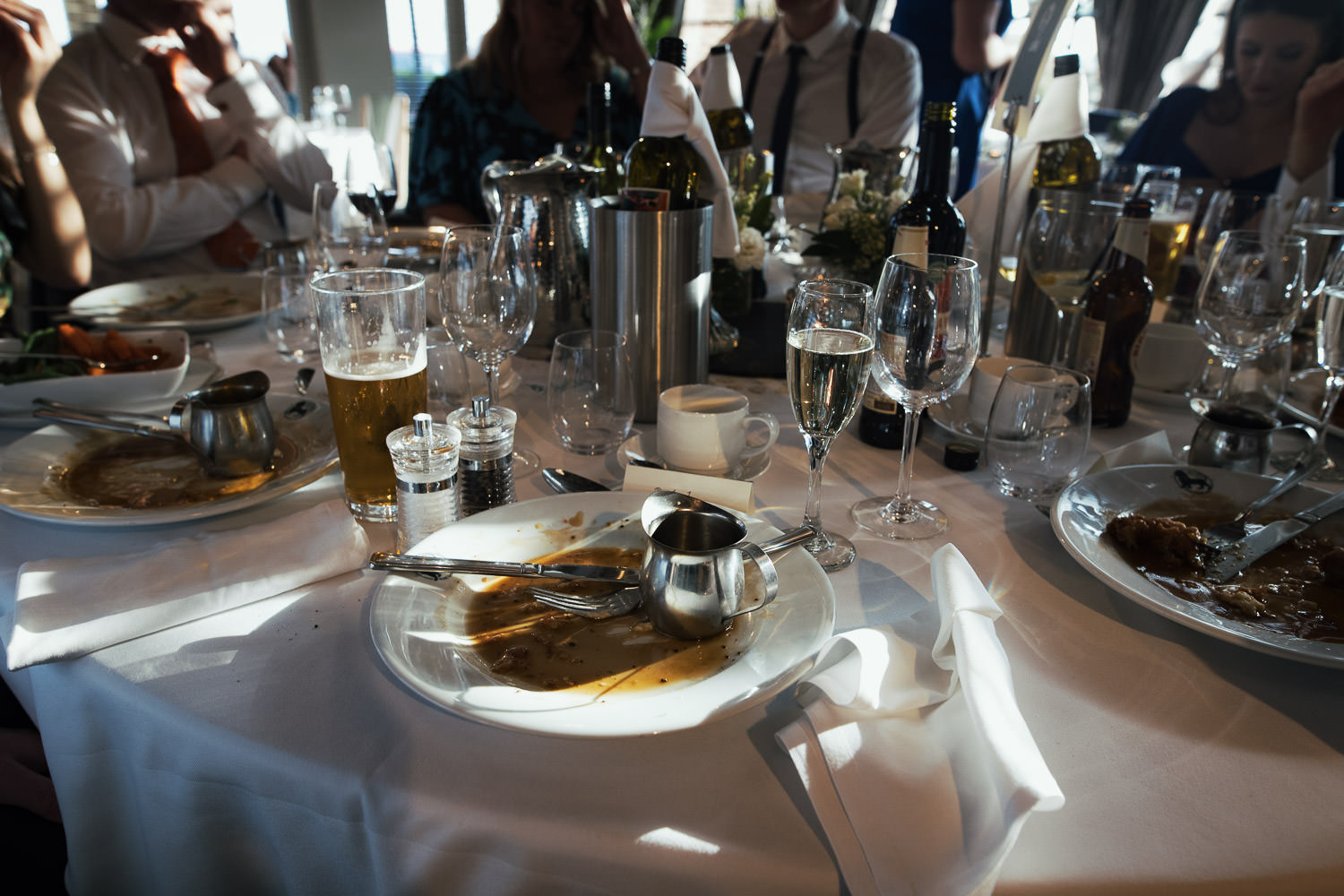 The Lion House Wedding Breakfast: An empty plate, just gravy left, set on a round table.