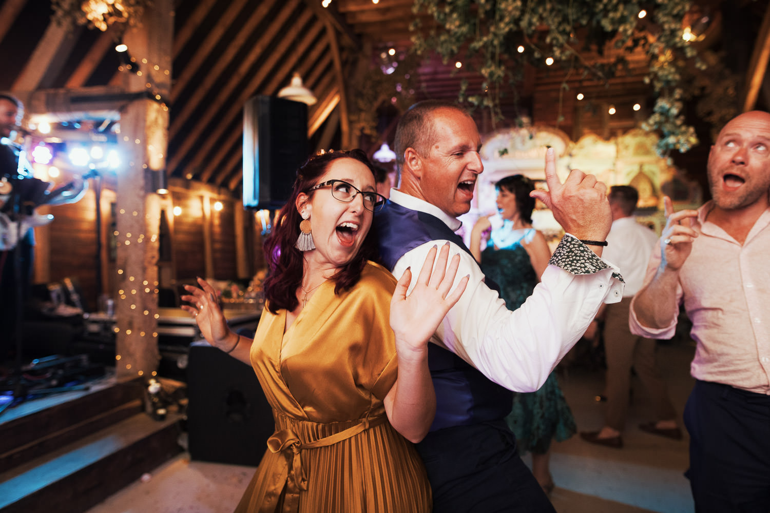 People on the dance floor in the barn at Preston Court.