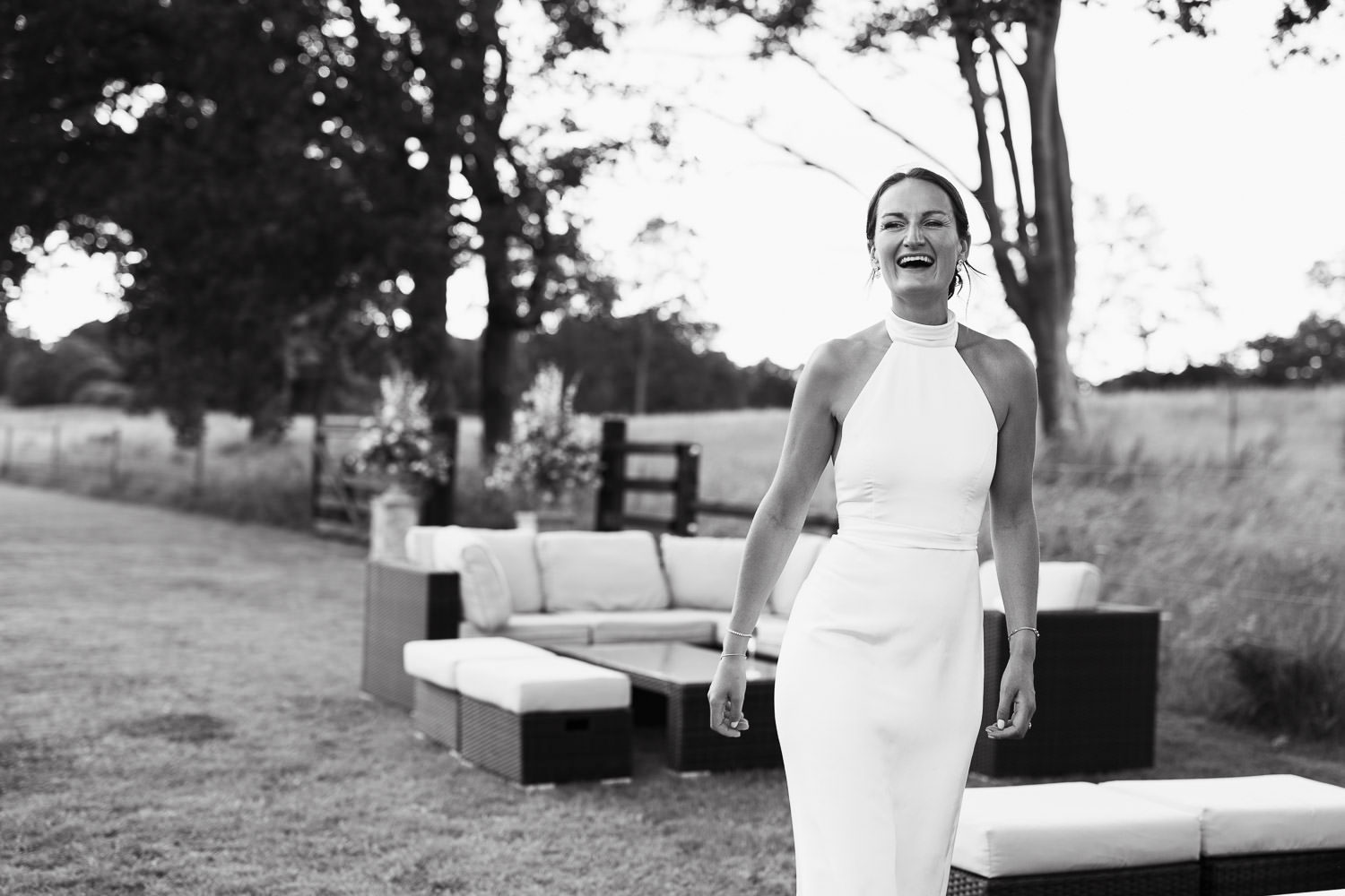 Documentary wedding photography by Tracy Morter Photography in Essex, featuring a bride in a Katrine Mogensen design, old money style wedding dress at a marquee wedding at home on private land. Capturing timeless elegance and refined celebration.