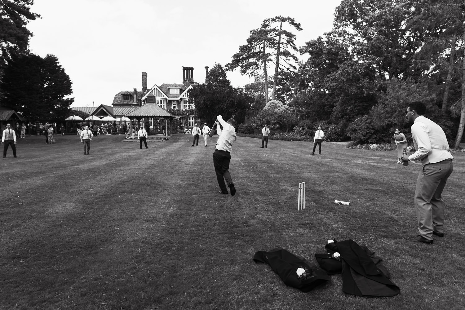 Baddow Park House: Lawn games, guests play cricket in the sunshine. Chelmsford wedding venue.