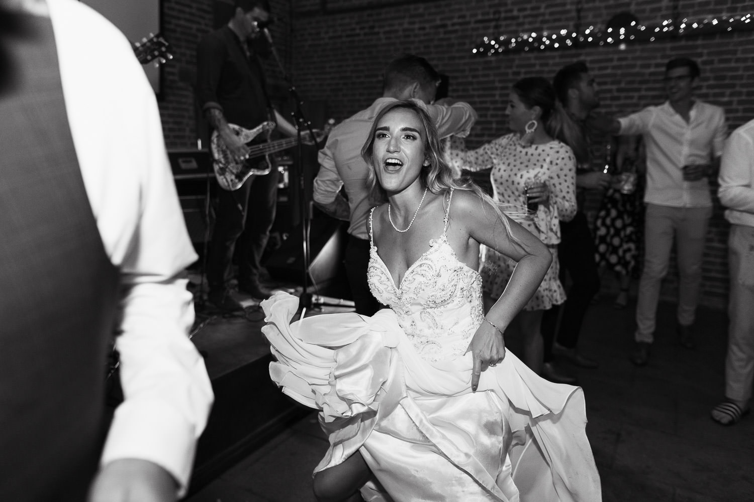 Haughley Park Barn Wedding: Bride dancing in Samirah dress by Sottero and Midgley.