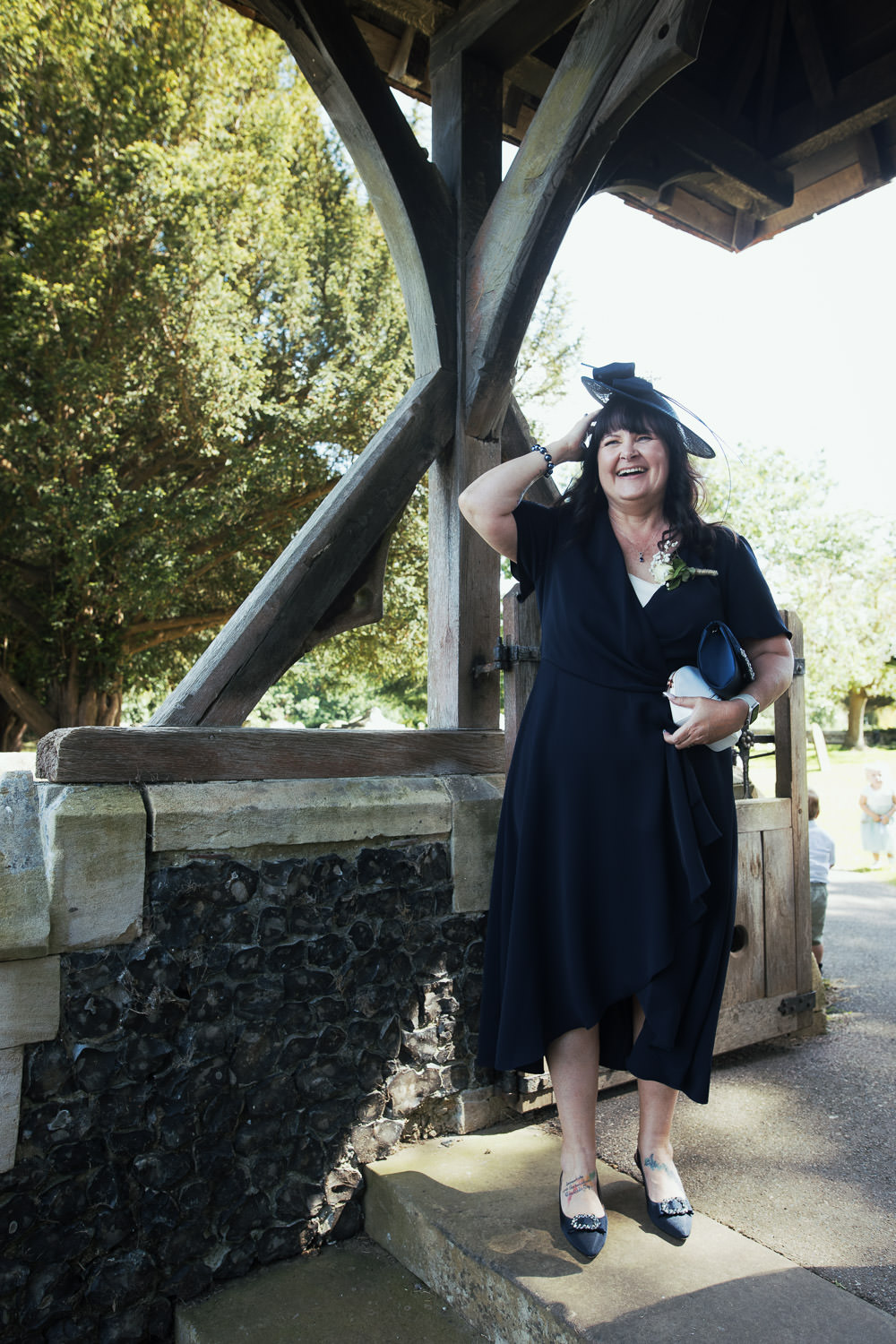 Mother of the bride outside St Peter and St-Pauls Church Faversham.