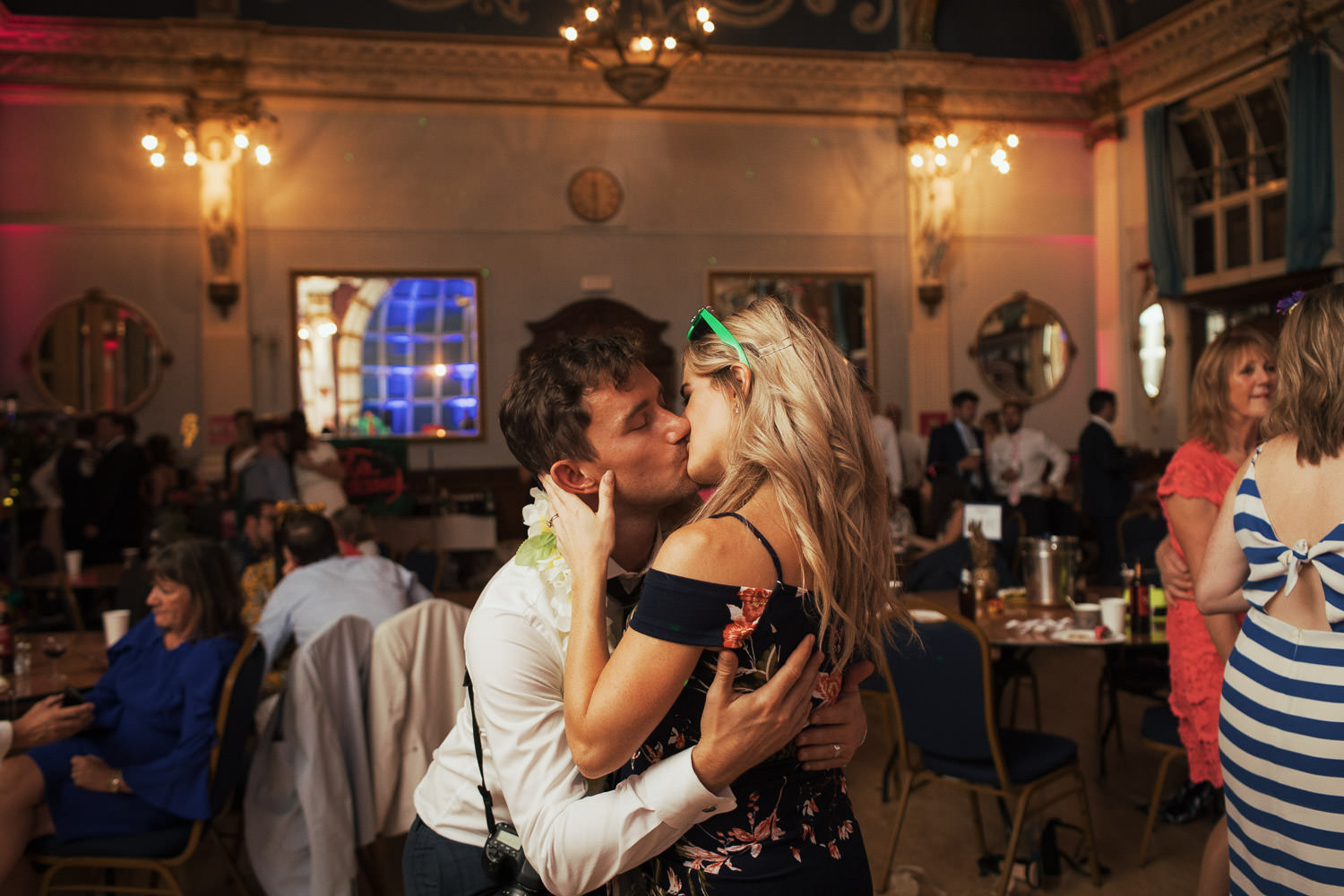 A couple kissing at a wedding reception at The Old Finsbury Town Hall.