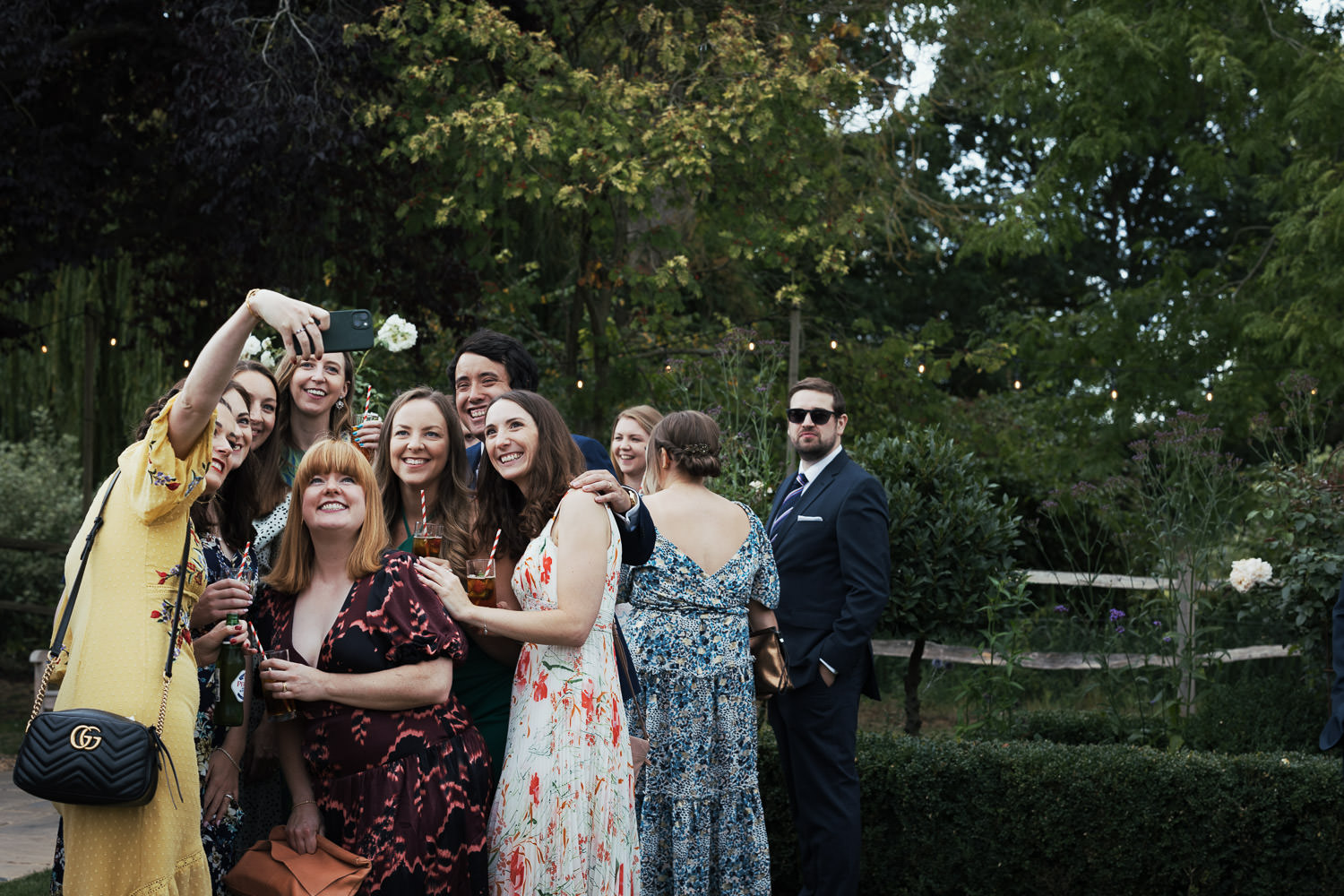 At Houchins a groom of people take a selfie.