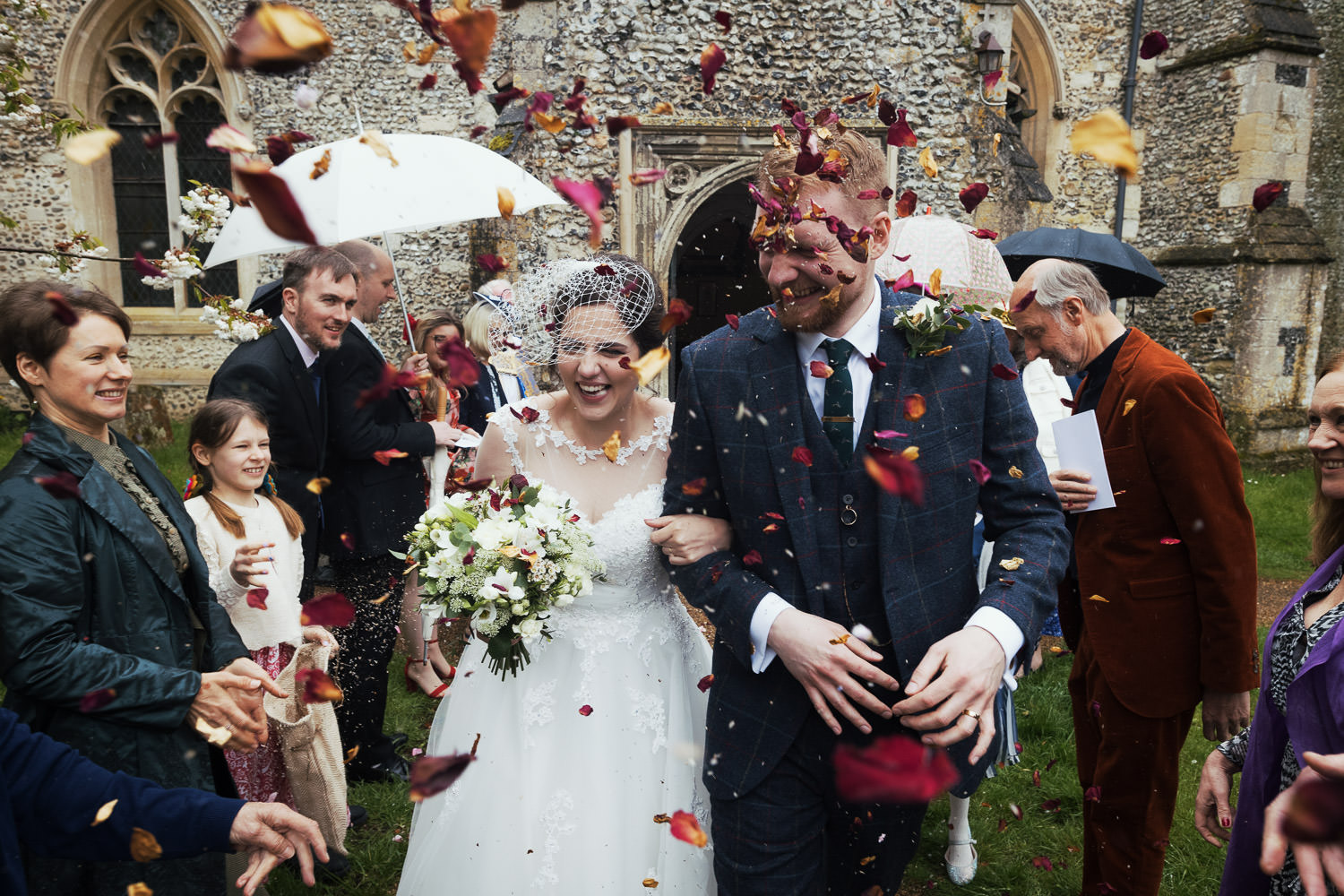 Confetti at round tower Church of St. Mary Little Linton, Bartlow, Cambridge CB21 4PL True Bride Brighton Belle Fifties style tea wedding dress. Mae/W183