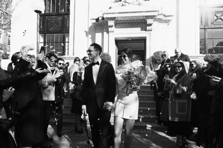 Registry office weddings London – confetti thrown at bride and groom outside Islington Town Hall.